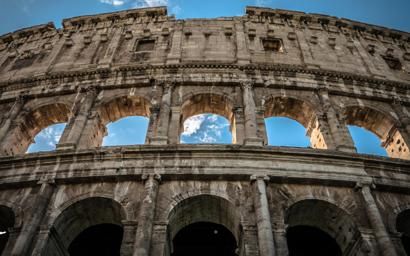 suggestive view colosseum and blue sky